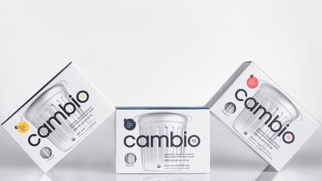 Three boxes of cambio aluminum coffee pods piled on to eachother