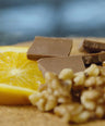 lemon, chocolate, and nuts on a platter