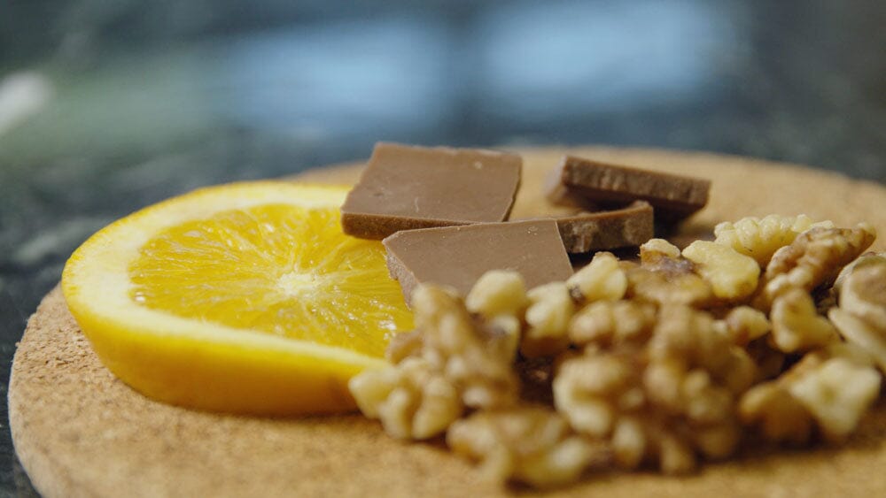 lemon, chocolate, and nuts on a platter