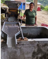 lady getting a machine ready for coffee drying