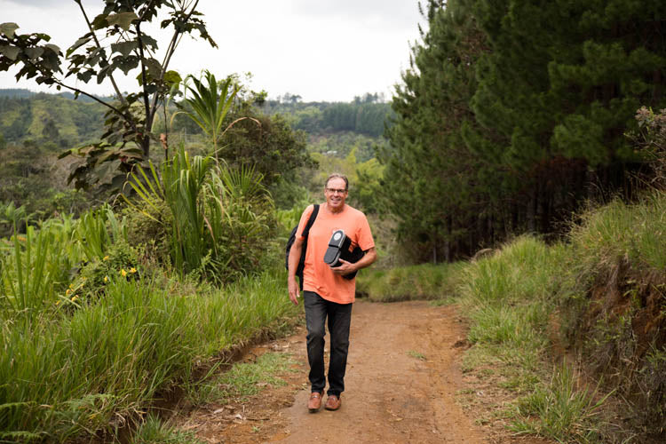 cambio founder walking in columbia with a coffee maker