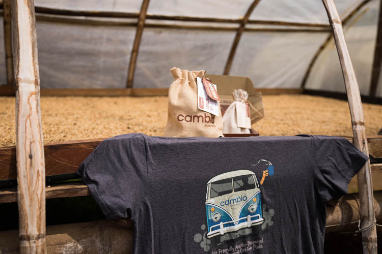 cambio roasters products in front of a bunch of coffee beans