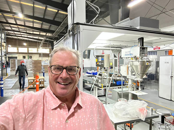 founder of cambio roasters in his facility