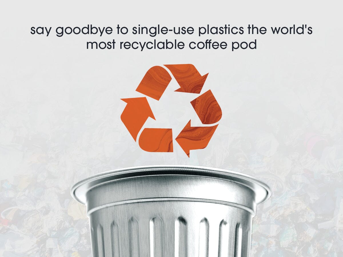 Recycling symbol on a coffee pod with text about single-use plastics and recyclability.
