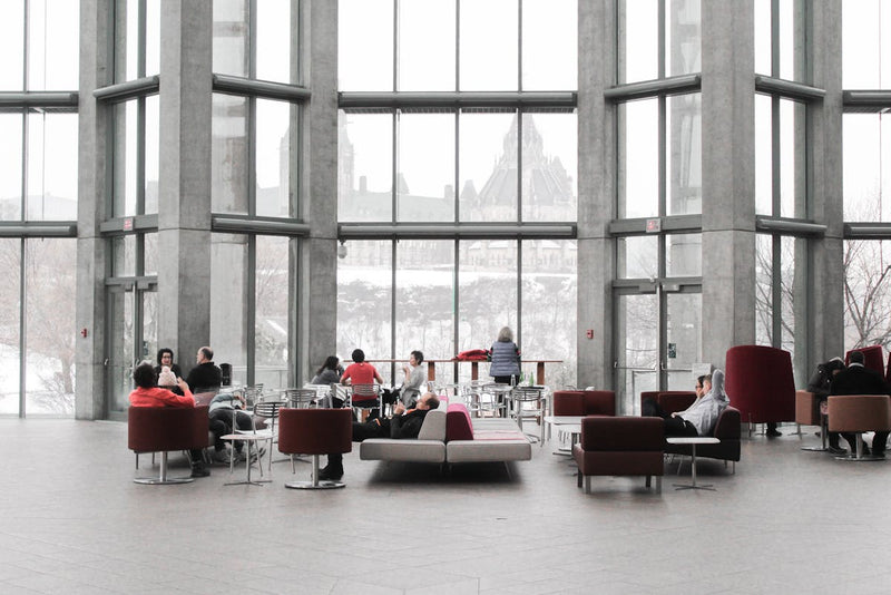 large office room that a ton of people are relaxing in