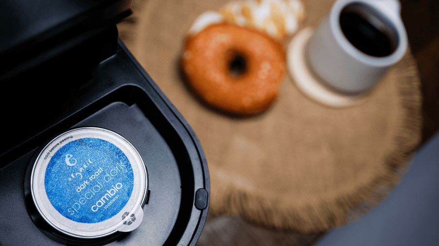 A cambio aluminum coffee pod sitting inside a keurig
