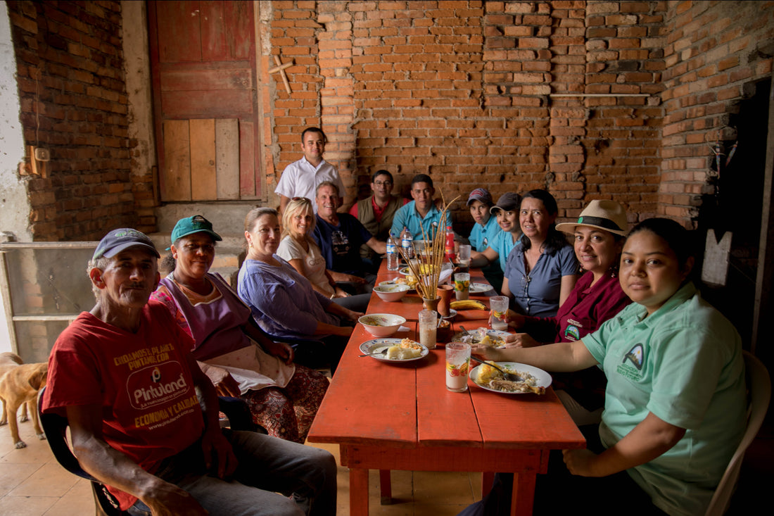 a group of people sitting around a table