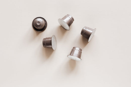 Aluminum coffee pods all on a table