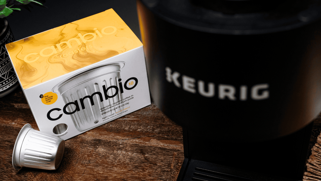 A keurig with some cambio aluminum coffee pods next to it