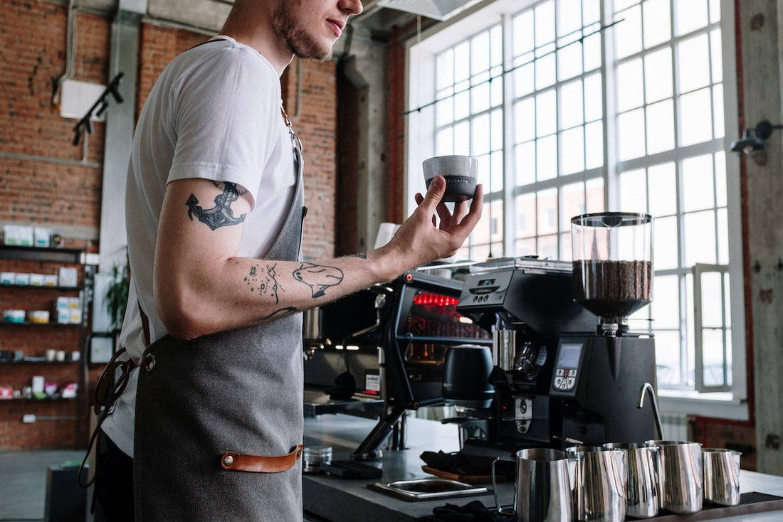 a coffee tester testing out a new coffee type in a coffee shop