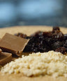 a platter of chocolate, spice, and raisins