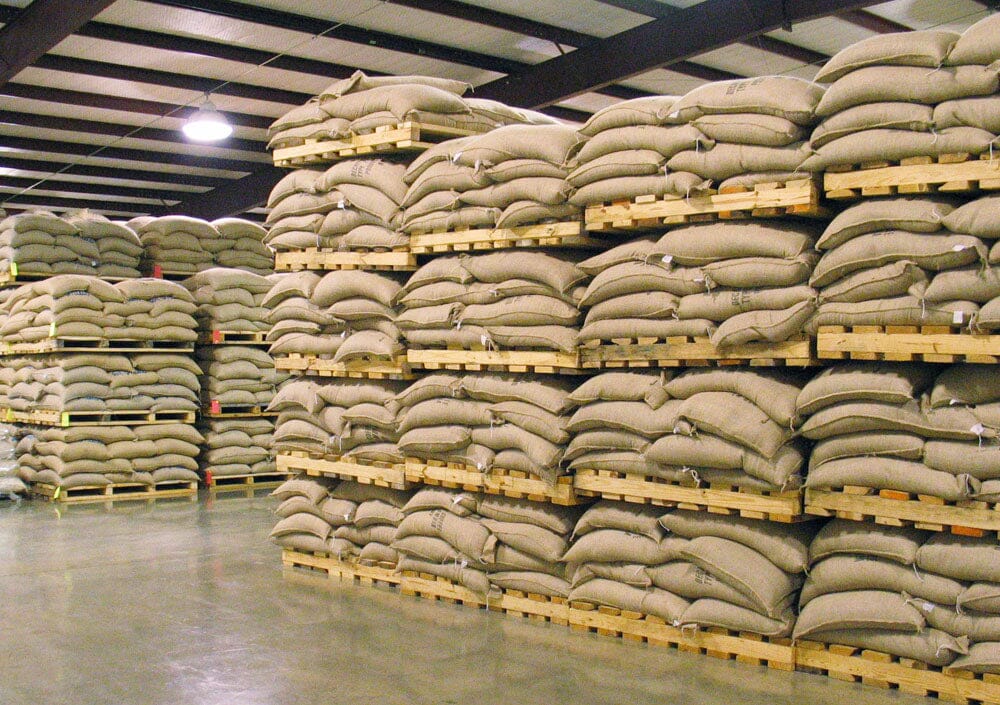 a warehouse full of sacks of coffee beans