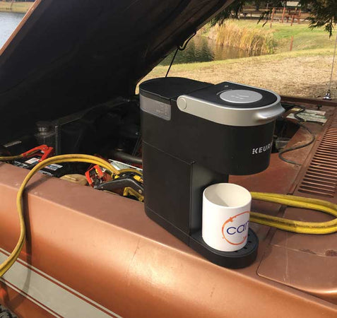 keurig rigged up to a car battery to brew coffee