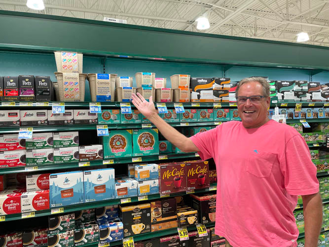 cambio founder pointing at his product in stores