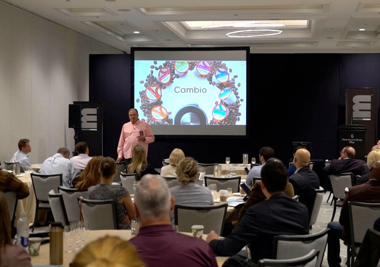 cambio roasters founder talking to a room full of people