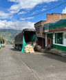 a truck that is being loaded with coffee beans