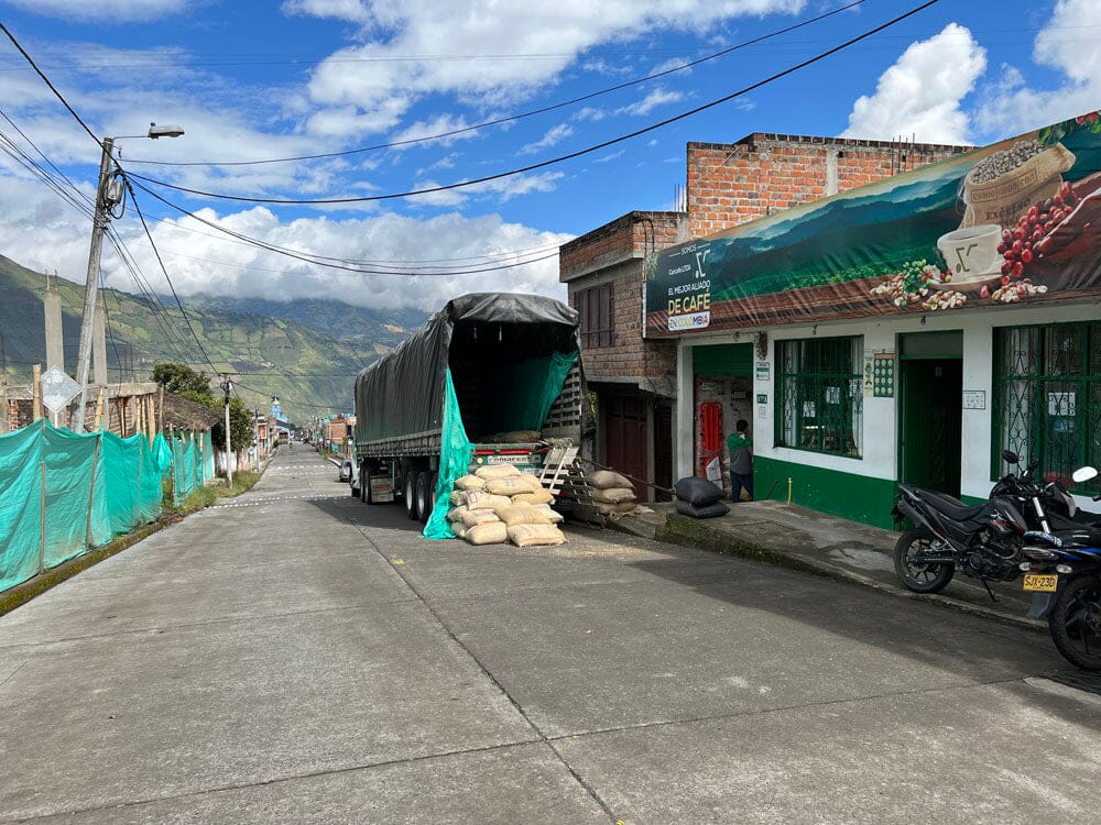 a truck that is being loaded with coffee beans