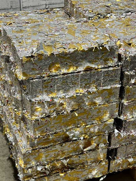 a pile of recycles aluminum to make the special k-cups